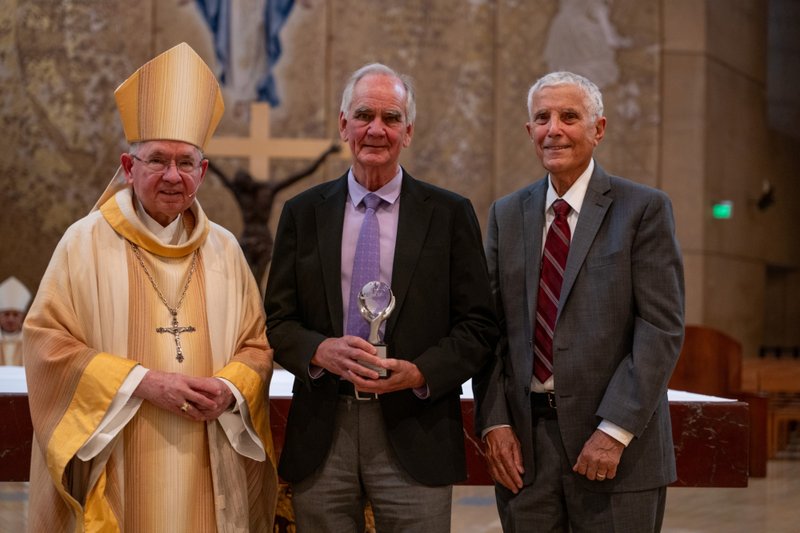 Archbishop José H. Gomez poses with Dr. Terry Schick, who received the Catholic Doctor of the Year Award, and Thomas Liautaud, Mission Doctors Association's president, during the Healthcare Professionals Mass, known as the White Mass, at the Cathedral of Our Lady of the Angels on Oct. 12. (Lizzie Friedrich)