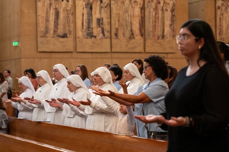 Attendees pray during the Healthcare Professionals Mass, known as the White Mass, at the Cathedral of Our Lady of the Angels on Oct. 12. (Lizzie Friedrich)
