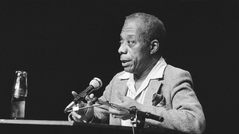 James Baldwin at a lecture in Amsterdam in 1984. (Wikimedia Commons/Sjakkeliem Vollebregt)