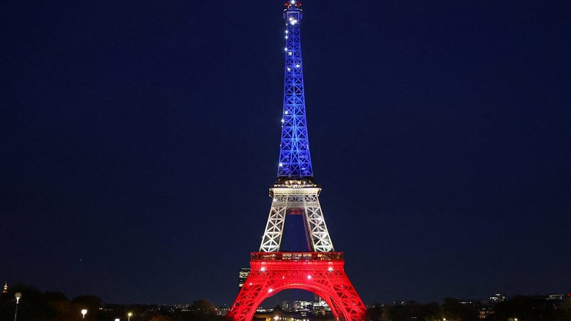 The Eiffel Tower is lit up with the blue, white and red colors of the French flag in Paris Nov. 12, 2025, to mark the tenth anniversary of the Nov. 13, 2015, attacks. (OSV News photo/Abdul Saboor, Reuters)