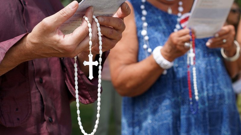 People hold rosaries while participating in a roadside prayer rally marking Religious Freedom Week at St. James Church in Setauket, N.Y., June 24, 2020. The U.S. observes International Religious Freedom Day Oct. 27 to commemorate the signing of the International Religious Freedom Act in 1998. In its 2025 report, the Vienna-based Observatory on Intolerance and Discrimination against Christians, or OIDAC, noted "a significant rise in personal attacks" against Christians in 2024 in Europe. (OSV News photo/CNS file, Gregory A. Shemitz)