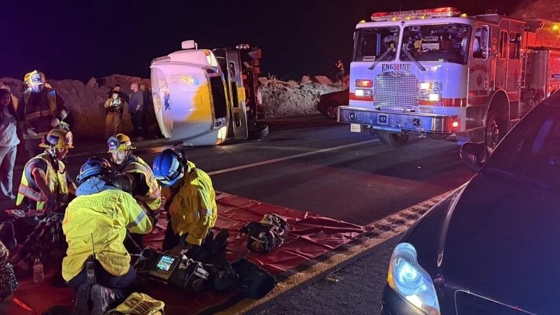 First responders provide aid after a bus carrying a group of mostly teenagers from Our Lady of Guadalupe Catholic Church in Santa Ana, California, on its way home from a three-day retreat at Camp Nawakwa in the San Bernardino Mountains crashed on a two-lane highway near Running Springs on Nov. 9, 2025. (San Bernardino County Fire Protection District via CNA)