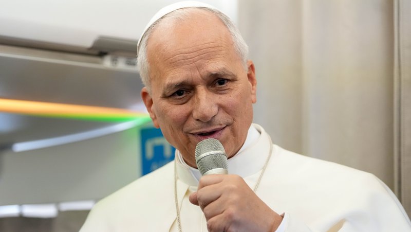 Pope Leo XIV answers a question from a journalist aboard his flight back to Rome from Lebanon, Dec. 2, 2025. (CNS photo/Lola Gomez)