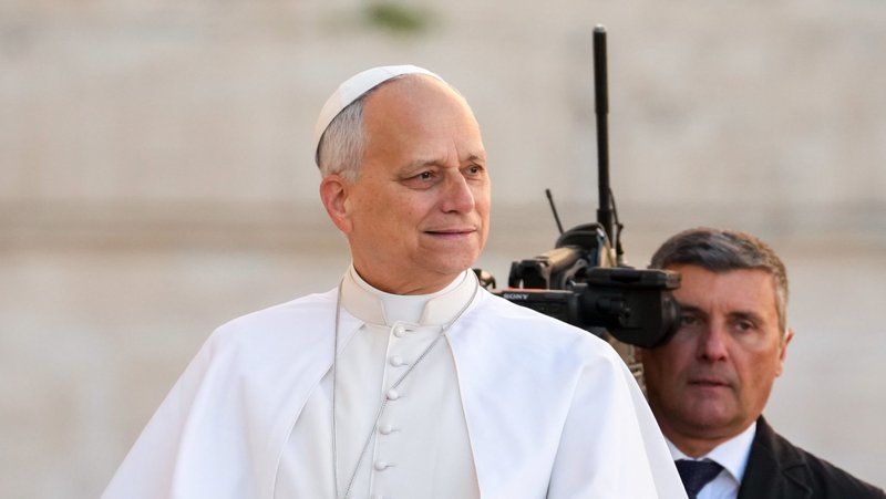 Pope Leo XIV smiles as he greets visitors and pilgrims from the popemobile as he rides around St. Peter's Square at the Vatican before his weekly general audience Dec. 10, 2025. (CNS photo/Lola Gomez)