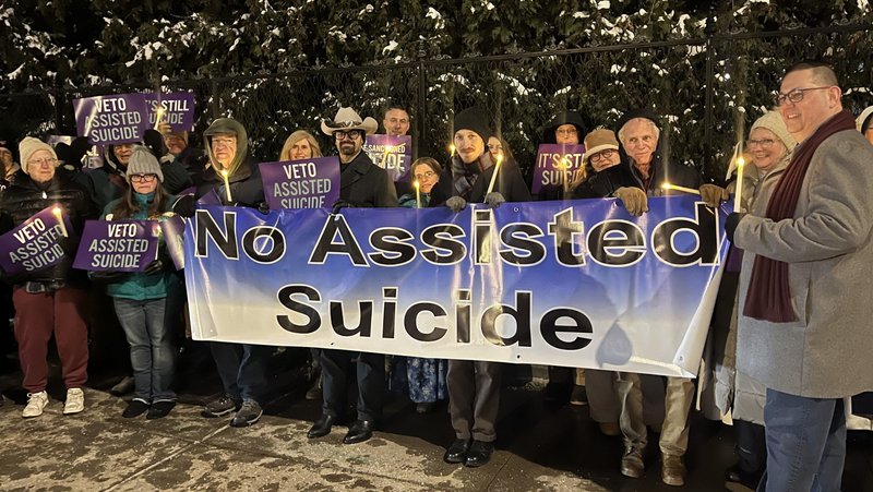 Opponents of New York state's proposed assisted suicide bill stand outside the governor's mansion in Albany, Dec. 3, 2025, for a candlelight vigil urging for Gov. Kathy Hochul to veto the bill passed by the Legislature June 9. Hochul announced Dec. 17 that she would sign an amended bill in January. (OSV News photo/Emily Benson, The Evangelist)