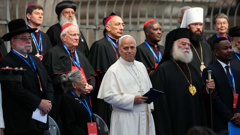 Pope Leo XIV joins religious leaders at the International Meeting of Dialogue and Prayer for Peace near the Colosseum in Rome Oct. 28, 2025. In his message for World Peace Day, the pope said religious leaders must refute "forms of blasphemy that profane the holy name of God" by using religion to defend war. (CNS photo/Lola Gomez)