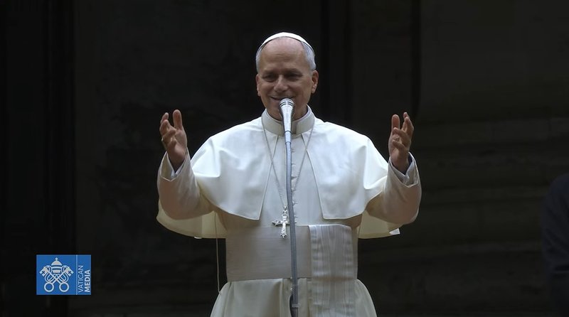 Pope Leo XIV greets the overflow crowd of some 5,000 people unable to enter St. Peter's Basilica for Christmas Eve Mass on Dec. 24, 2025. (Vatican Media)