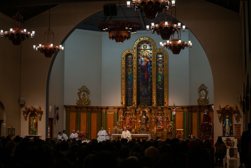 Father Gilbert Guzman, pastor of Sacred Heart Church in Altadena, presides over a Jan. 7 healing Mass on the one-year anniversary of the Eaton Fire. (John Rueda)