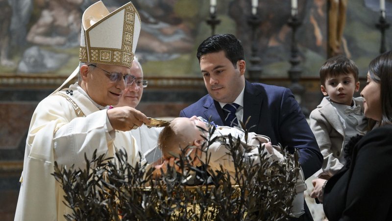 Pope Leo XIV baptizes one of 20 children in the Sistine Chapel at the Vatican Jan. 11, 2026, the feast of the Baptism of the Lord. (OSV News photo/Simone Risoluti, Vatican Media)
