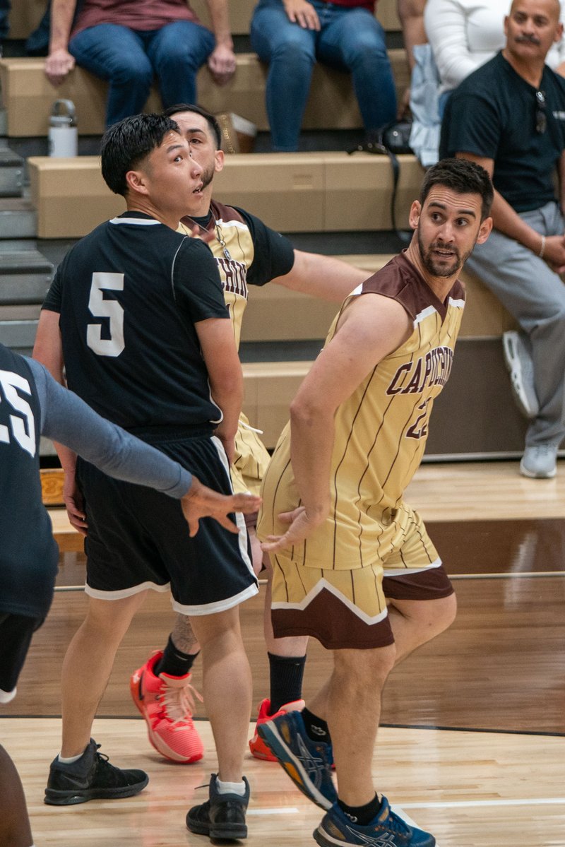 Game action as the Capuchin Franciscans play against the seminarians in the Archdiocese of Los Angeles' annual priests vs. seminarians basketball game, this year on Jan. 18 at St. Francis High School in La Cañada Flintridge. (John Rueda)