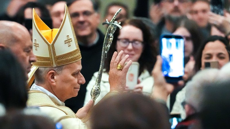 Pope Leo XIV waves as he arrives in a procession to preside over an evening prayer service at the Basilica of St. Paul Outside the Walls in Rome Jan. 25, 2026, concluding the Week of Prayer for Christian Unity. (CNS photo/Lola Gomez)