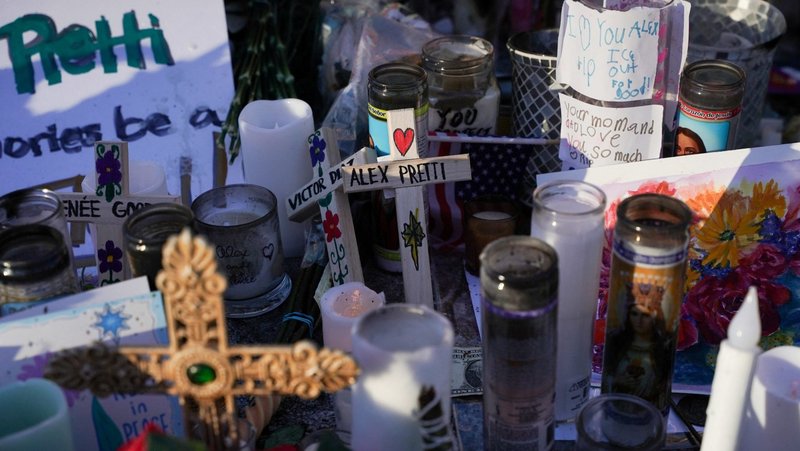 Crosses and candles are placed at a makeshift memorial in Minneapolis Jan. 28, 2026, at the site where Alex Pretti, a 37-year-old intensive care unit nurse was fatally shot by federal agents trying to detain him. (OSV News/Seth Herald, Reuters)