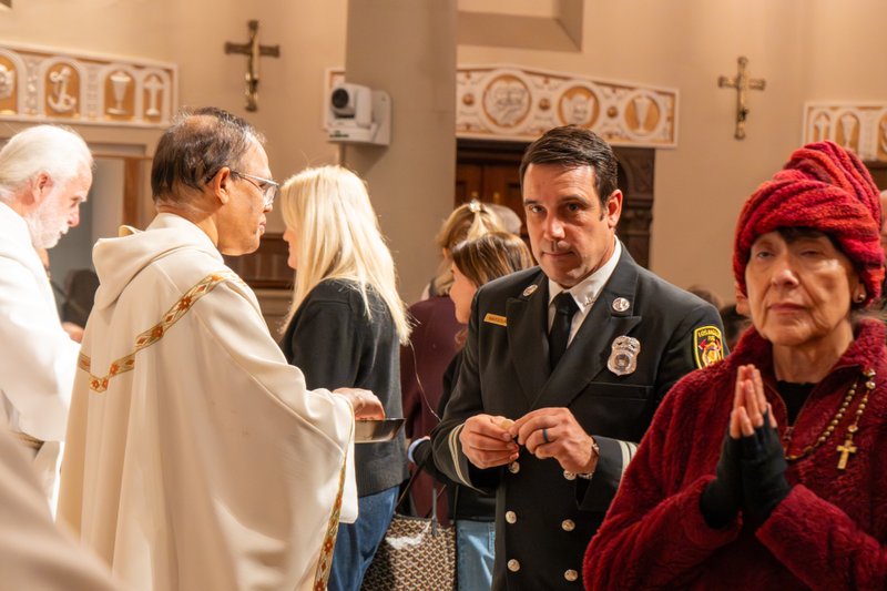 LA Fire Capt. Bryan Nassour, who rescued Corpus Christi’s tabernacle from the ashes of the destroyed church, was recognized during a Jan. 7 Mass on the one-year anniversary of the Palisades Fire at St. Monica Church in Santa Monica. (Elizabeth Friedrich)