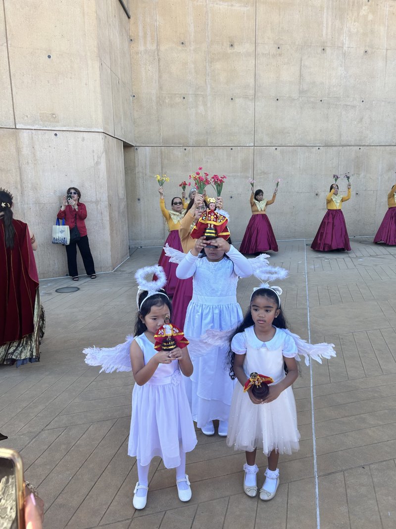 Young people carry statues of Santo Niño in the outdoor plaza of the Cathedral of Our Lady of the Angels prior to a special Mass on Jan. 18. (Carolina Guevara)