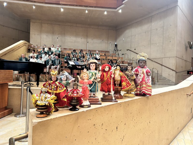 Santo Niño statues are lined up inside the Cathedral of Our Lady of the Angels for a special Mass on Jan. 18. (Carolina Guevara)