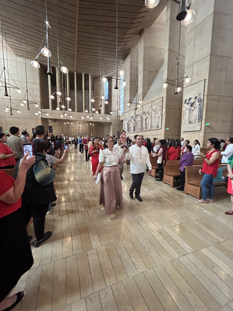 Attendees process in to the Cathedral of Our Lady of the Angels on Jan. 18 for the Feast of Santo Niño Mass. (Carolina Guevara)
