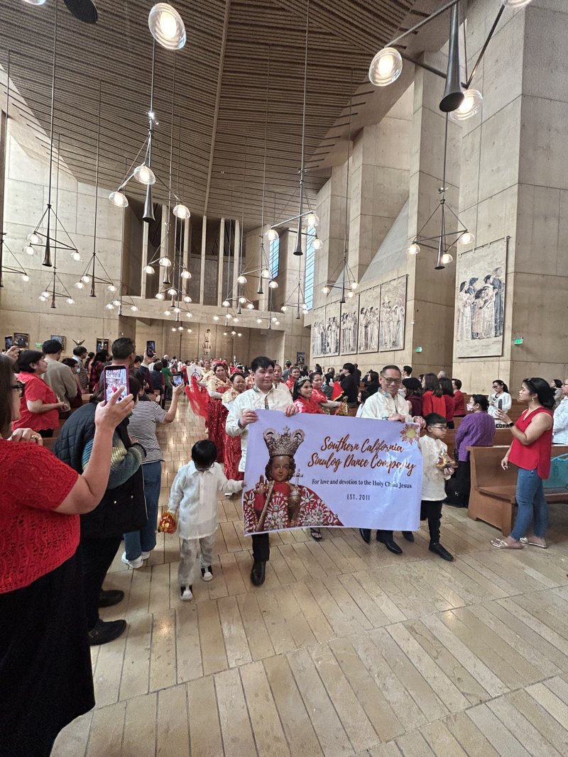 Attendees process in to the Cathedral of Our Lady of the Angels on Jan. 18 for the Feast of Santo Niño Mass. (Carolina Guevara)
