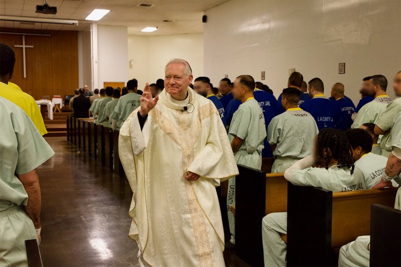 Auxiliary Bishop Matt Elshoff offers blessings as he celebrated Christmas Day Mass with inmates at Men’s Central Jail near downtown LA. (Reese Cuevas)