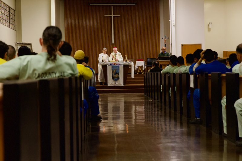 Auxiliary Bishop Matt Elshoff celebrates Christmas Day Mass with inmates at Men’s Central Jail near downtown LA. (Reese Cuevas)