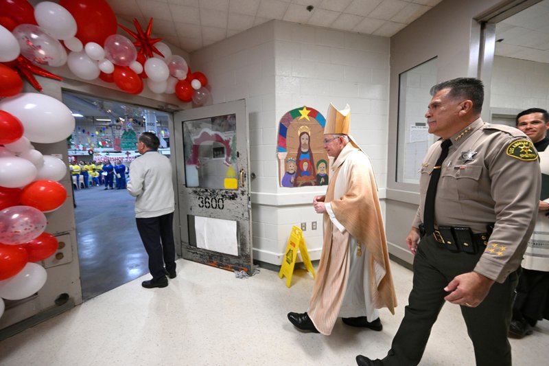 Archbishop José H. Gomez and Los Angeles County Sheriff Robert Luna walk into Century Regional Detention Facility in Lynwood, LA County’s largest women’s jail, during Christmas Mass Dec. 25, 2025. (John McCoy)