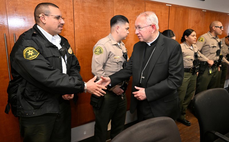 Archbishop José H. Gomez greets sheriff's deputies as he celebrated Mass at Century Regional Detention Facility in Lynwood, LA County’s largest women’s jail, on Christmas Day, Dec. 25, 2025. (John McCoy)