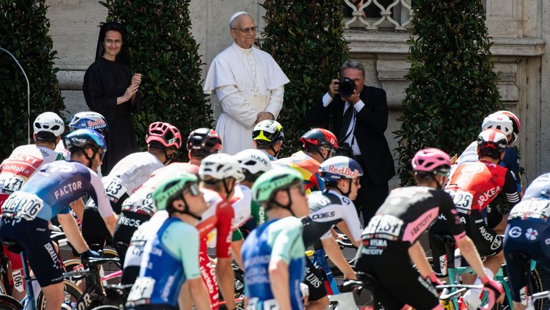 Pope Leo XIV watches as cyclists participating in the Giro d’Italia begin their ride through the Vatican Gardens during a special passage through Vatican City June 1, 2025. (CNS photo/Cristian Gennari, pool)