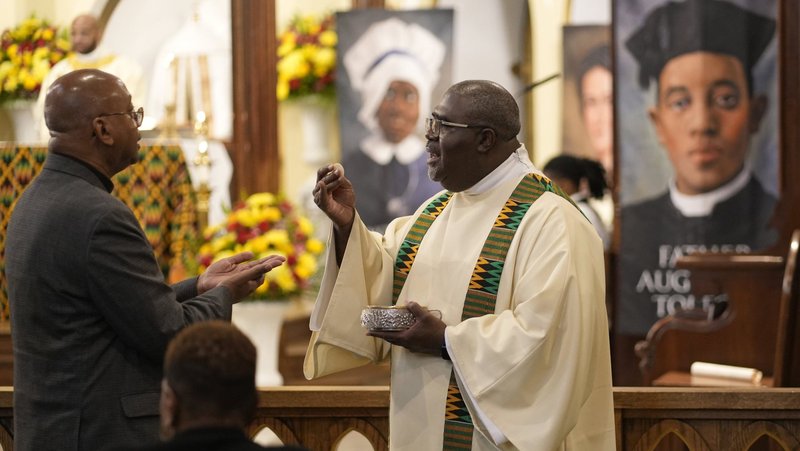 Deacon Michel Hodge distributes Communion during Mass at the inaugural New York Black Catholic Congress at Blessed Sacrament Church in New Rochelle, N.Y., Nov. 22, 2025. Two U.S. bishops in a Feb. 3, 2026, statement urged Catholics to be "faithful stewards of memory" and "courageous witnesses to truth" during Black History Month, observed in February. (OSV News photo/Gregory A. Shemitz)