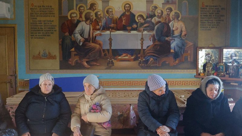 Residents wait inside a church for the arrival of volunteers distributing humanitarian aid in the Luhansk region of Ukraine Feb. 4, 2026. The fourth anniversary of Russia's full-scale invasion of Ukraine is Feb. 24. (OSV News photo/Alexander Ermochenko)