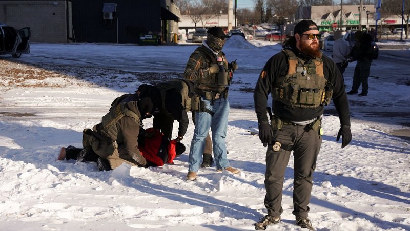 Immigration and Customs Enforcement (ICE) agents detain a man as they conduct immigration enforcement action in St. Paul, Minn., Jan 27, 2026. (OSV News photo/Seth Herald, Reuters)