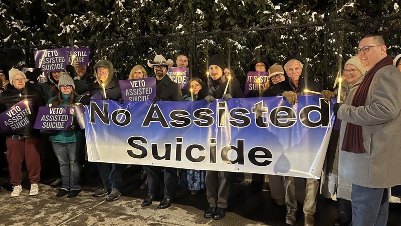 Opponents of New York state's proposed assisted suicide bill stand outside the governor's mansion in Albany Dec. 3, 2025, for a candlelight vigil urging Gov. Kathy Hochul, a Catholic, to veto the bill passed by the Legislature June 9. Hochul signed the measure into law Feb. 6, 2026. (OSV News photo/Emily Benson, The Evangelist)