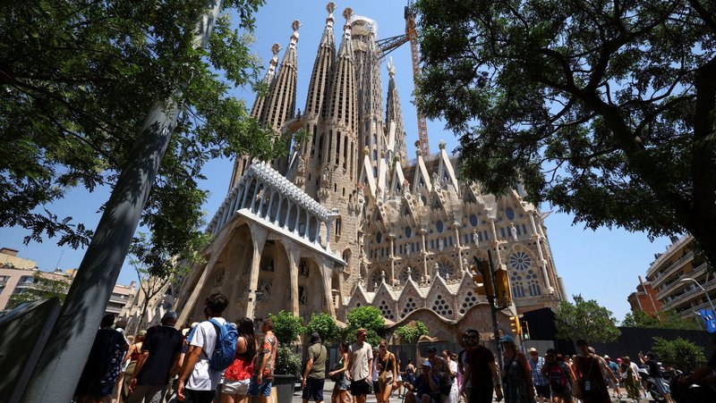 Groups of tourists walk around the Basilica of the Holy Family, known in Spanish as Sagrada Familia, in Barcelona, Spain, June 30, 2025. Pope Leo XIV will visit Barcelona in June 2026 to mark the centenary of the death of the Sagrada Familia’s iconic architect, Servant of God Antoni Gaudí. (OSV News photo/Albert Gea, Reuters)
