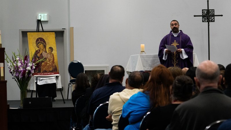 Father Ala Musharbash, the chaplain for the Arab American Catholic Community, based out of St. Joseph Church in Pomona, offers the homily during the first-ever Arabic Mass at RECongress on Feb. 21. (Katie Trejo)