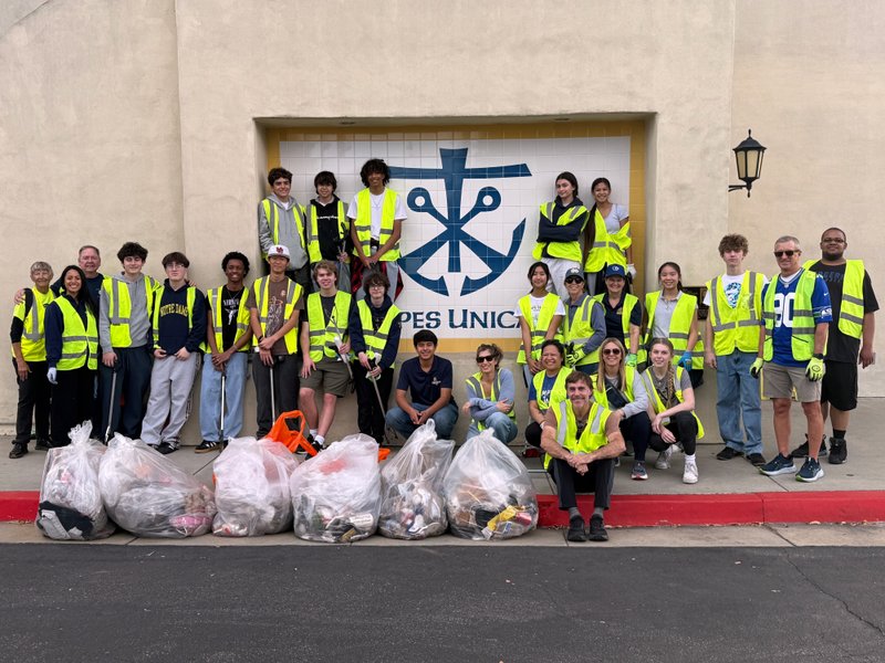 Students at Notre Dame High School participate in a day of service cleaning up trash on the streets near their school during Catholic Schools Week. (Notre Dame High School)