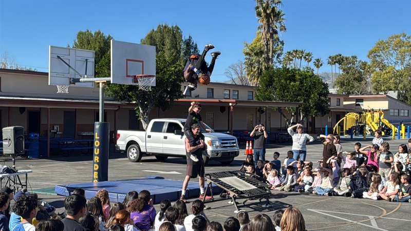 Students at Our Lady of Lourdes School in Northridge are entertained by the TNT Dunk Squad during Catholic Schools Week. (Our Lady of Lourdes School)