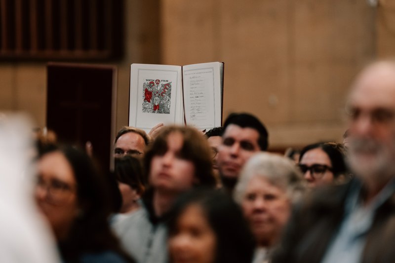 Catechists and catechumens process to the altar with the Book of the Elect during the Rite of Election ceremony at the Cathedral of Our Lady of the Angels on Feb. 15. (Peter Lobato)