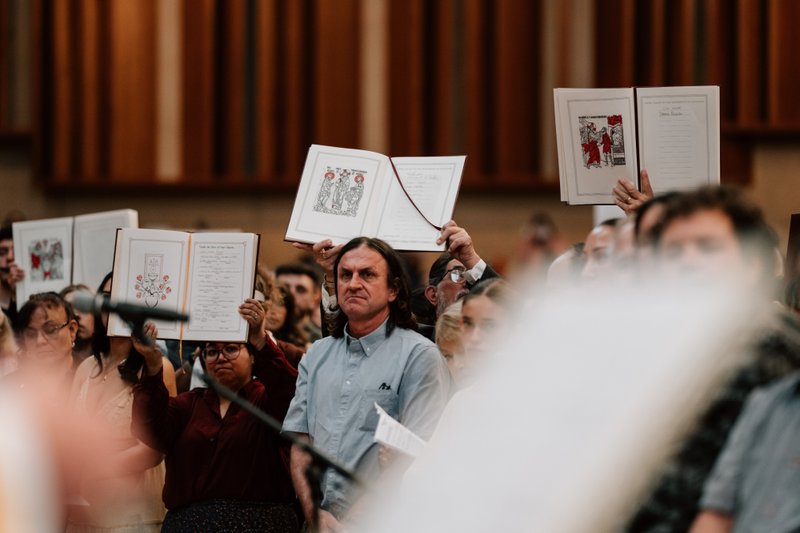 Catechists and catechumens process to the altar with the Book of the Elect during the Rite of Election ceremony at the Cathedral of Our Lady of the Angels on Feb. 15. (Peter Lobato)