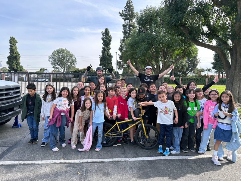 Students at St. Bruno School in Whittier pose with BMX riders during Catholic Schools Week. (St. Bruno School)