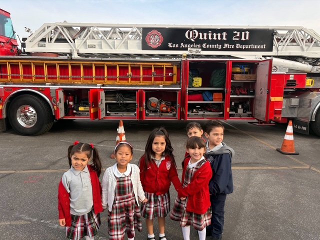 Students at St. Linus School in Norwalk pose with a Los Angeles County Fire Department truck during Catholic Schools Week. (St. Linus School)