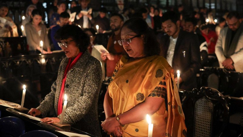 Women pray during Christmas Eve Mass at St. Paul's Cathedral in Kolkata, India, Dec. 24, 2025. (OSV News photo/Sahiba Chawdhary, Reuters)