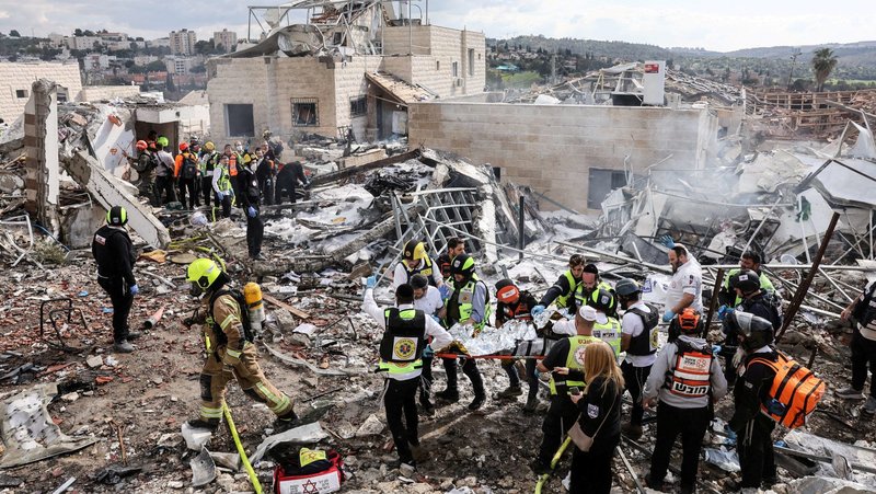 Emergency response teams attend the scene of a fatal Iranian strike in Beit Shemesh, Israel, March 1, 2026, after Iran launched missile barrages following attacks by the U.S. and Israel. (OSV News photo/Itay Cohen, Reuters) Editors: NO USE IN ISRAEL. NO COMMERCIAL OR EDITORIAL SALES IN ISRAEL