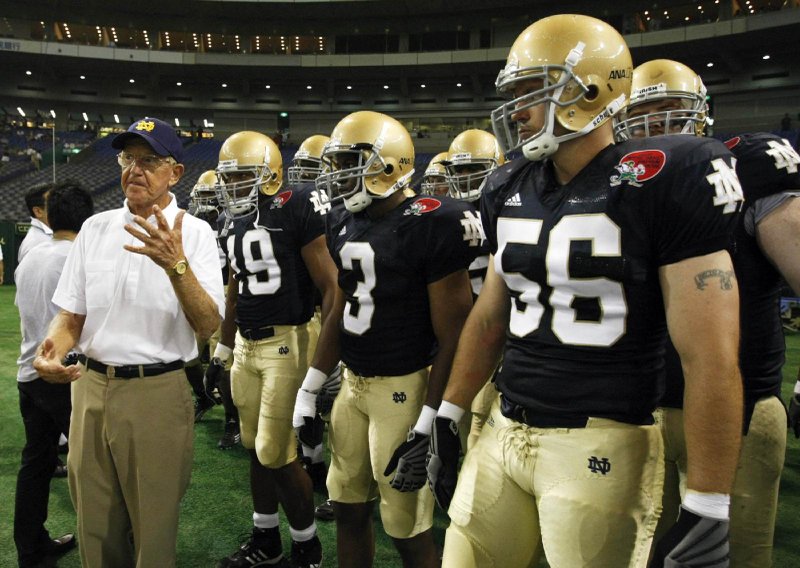 Notre Dame alumni coach Lou Holtz speaks to his team before the start of the Notre Dame Japan Bowl football game against Japan in Tokyo July 25, 2009. Holtz, a legendary college football coach and devout Catholic who led the University of Notre Dame to the 1988 National Championship, died March 4, 2026, at age 89. (OSV News/Issei Kato, Reuters)
