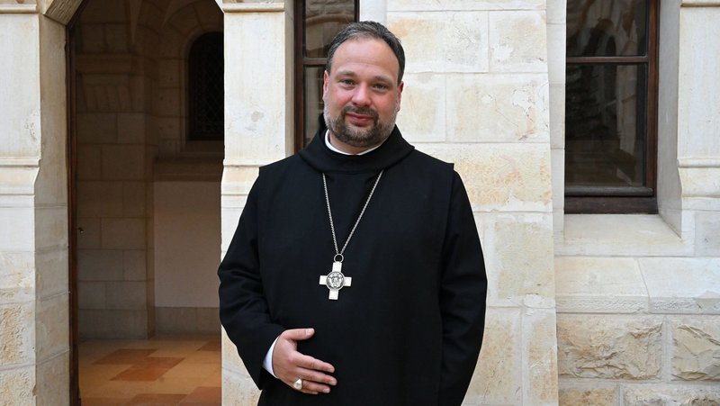 Father Nikodemus Schnabel, abbot of Dormition Abbey on Mount Zion in the Old City of Jerusalem, poses for a photo during an interview outside the abbey June 19, 2025. Amid the escalating chaos of another war in the Middle East that began Feb. 28, 2026, Father Schnabel told OSV News that the abbey has become an "island of hope in an ocean of suffering" where even people of different faiths have found refuge. (OSV News photo/Debbie Hill)