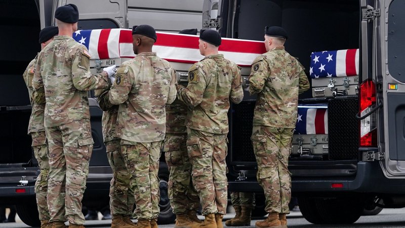 Members of the military carry a transfer case during the dignified transfer of the remains of six U.S. Army service members of the 103rd Sustainment Command at Dover Air Force Base in Del., March 7, 2026. The solders killed in Kuwait, were Maj. Jeffrey O'Brien, Capt. Cody Khork, Chief Warrant Officer Robert Marzan, Sgt. 1st Class Nicole Amor, Sgt. 1st Class Noah Tietjens and Sgt. Declan Coady, amid the U.S.-Israeli war with Iran. (OSV News photo/Nathan Howard, Reuters)