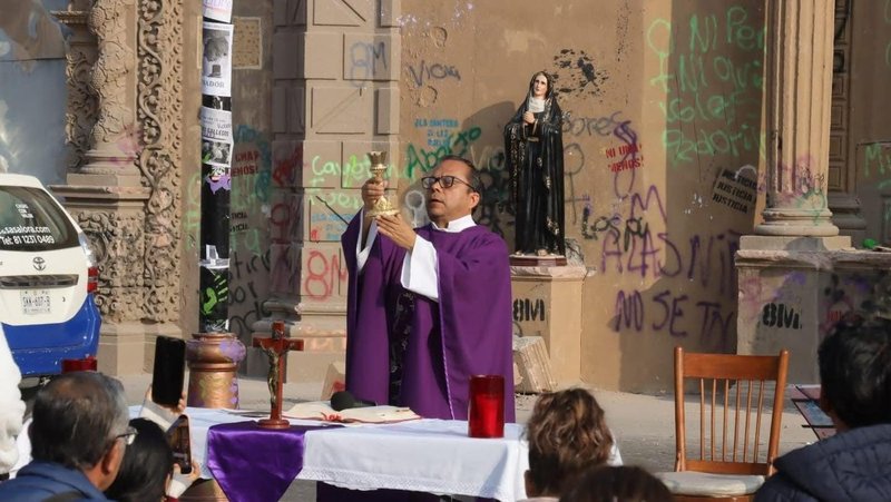 Father Jorge Aurelio Ramírez Torres celebrates March 9, 2026, in front of the Sagrario Metropolitano parish church in the north-central city of San Luis Potosí, Mexico. The church, which was built in the 17th century and was being restored, was vandalized March 8. Social media videos showed the church doors on fire and the building later graffitied by woman protesting on International Women's Day. (OSV News photo/courtesy Sagrario Metropolitano Parish)