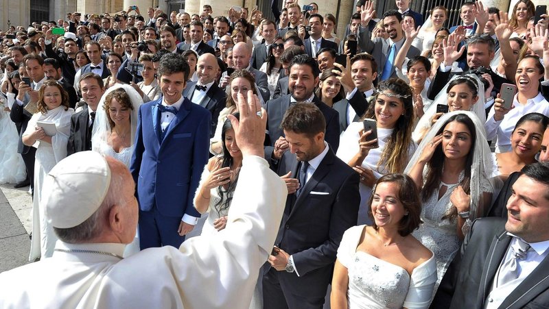 Pope Francis greets newly married couples during his general audience in St. Peter's Square at the Vatican in this Sept. 30, 2015, file photo. In 2016, the late pope, who died in 2025, released a major document, "Amoris Laetitia," which focused on love in the family. (CNS photo/L'Osservatore Romano)