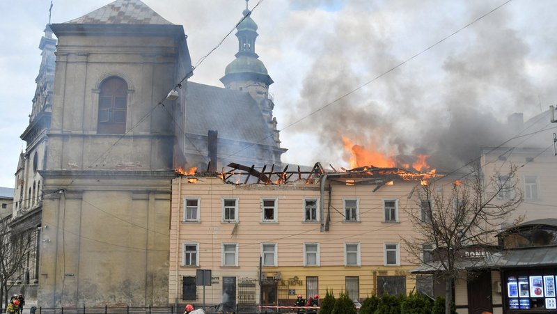 Firefighters work at the site of a residential building in Lviv, Ukraine, hit by a Russian drone strike March 24, 2026, amid Russia's massive nationwide attack on Ukraine that day. The building is adjacent to the Bernardine monastery complex and part of a UNESCO World Heritage Site. (OSV News photo/Reuters)