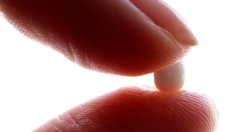 A woman holds a pill used for abortion in this photo illustration. A group of U.S. senators who oppose abortion sent investigatory letters to three abortion drug manufacturers seeking information about their products, as well as a similar letter to the U.S. Food and Drug Administration, their committee's Republican majority said March 25, 2026. (OSV News photo photo/Eric Gaillard, Reuters)
