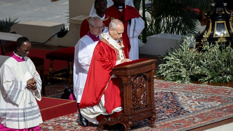 Pope Leo XIV kneels during Palm Sunday Mass in St. Peter's Square at the Vatican, March 29, 2026. (OSV News photo/Francesco Fotia, Reuters)