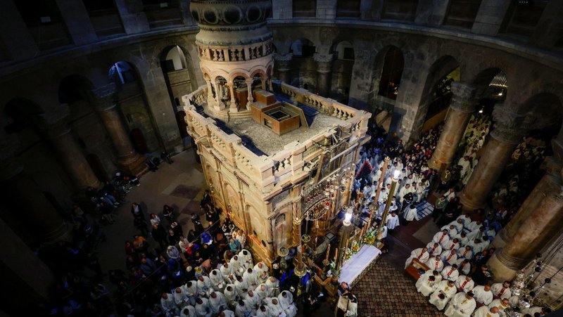 Members of the clergy pray outside the Edicule, the traditional site of Jesus' burial and resurrection, during the washing of the feet ceremony on Holy Thursday in the Church of the Holy Sepulcher in Jerusalem's Old City April 17, 2025. As Holy Week 2026 approaches, the Church of the Holy Sepulcher remains a place of continuous prayer despite restricted access to the faithful, according to a statement released March 21 by the Custody of the Holy Land, which also said uncertainty persists over upcoming Holy Week and Easter celebrations. (OSV News photo/Ammar Awad, Reuters)