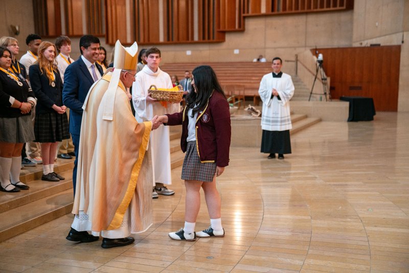Archbishop José H. Gomez congratulates students who were recipients at the 2026 Christian Service Awards Mass on March 10 at the Cathedral of Our Lady of the Angels. (John Rueda)
